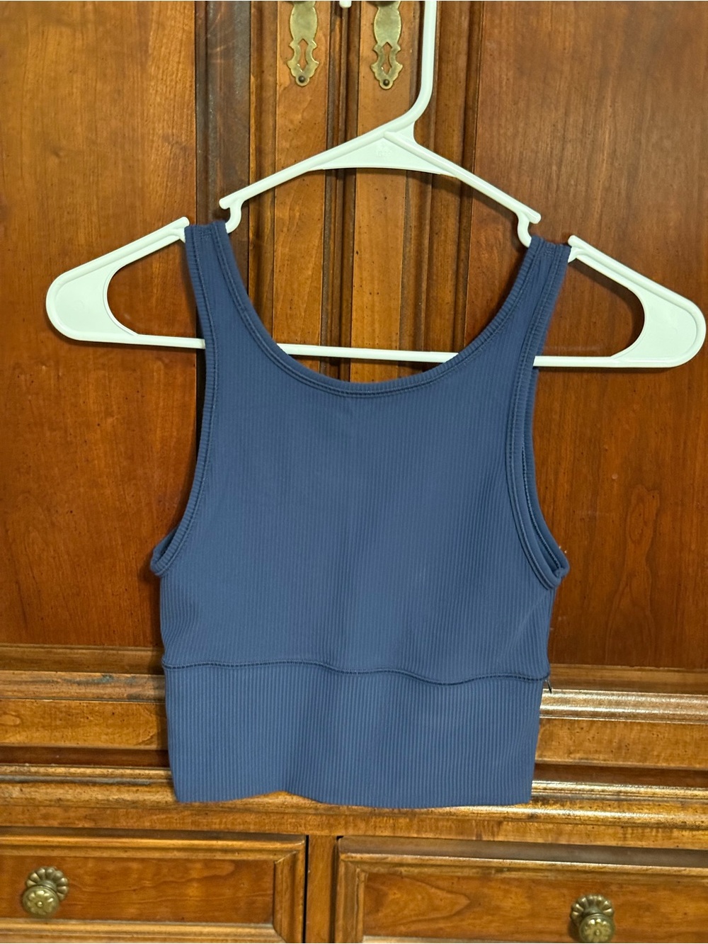 Lululemon top size small.  Fun low scoop back-high neckline front. Navy blue